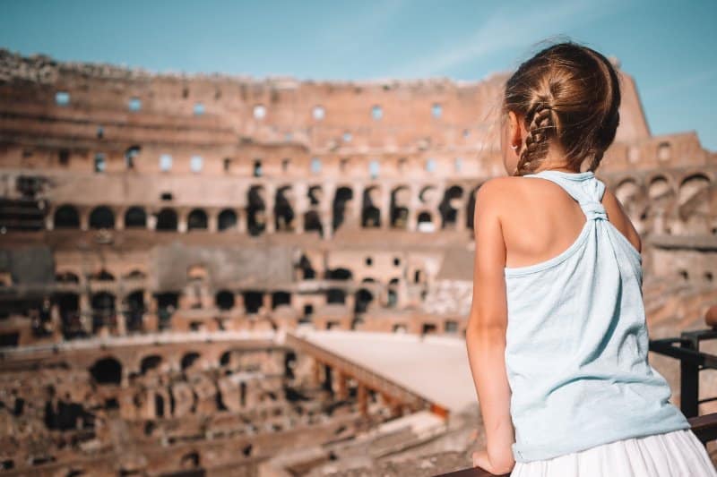 Kid looking at the Colosseum