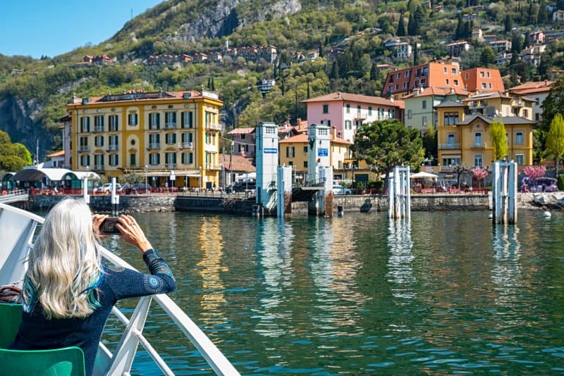 Tourist enjoying boat ride at Lake Como
