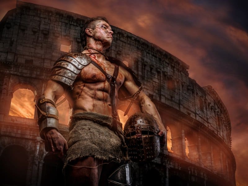 Gladiator standing with Colosseum in background