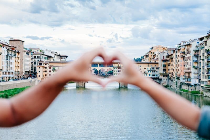 Couples in front of Ponte Vecchio, Florence