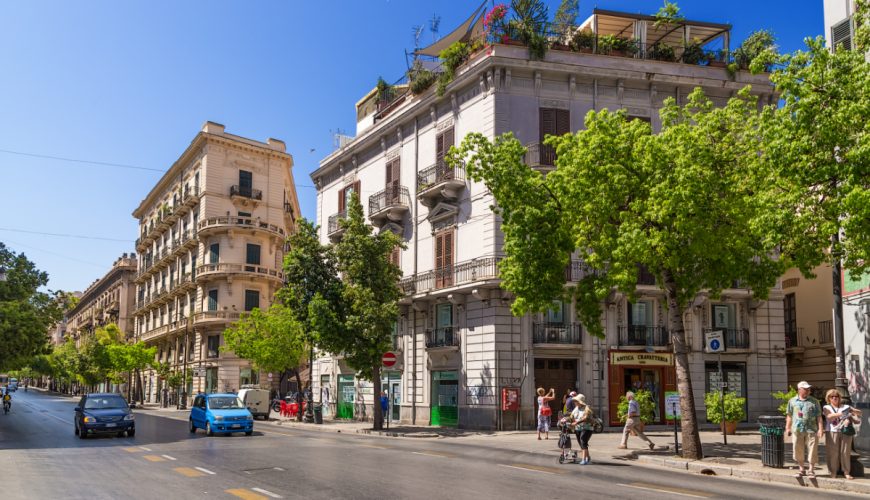 Panoramic view of a street and buildings on the side in Palermo, Italy