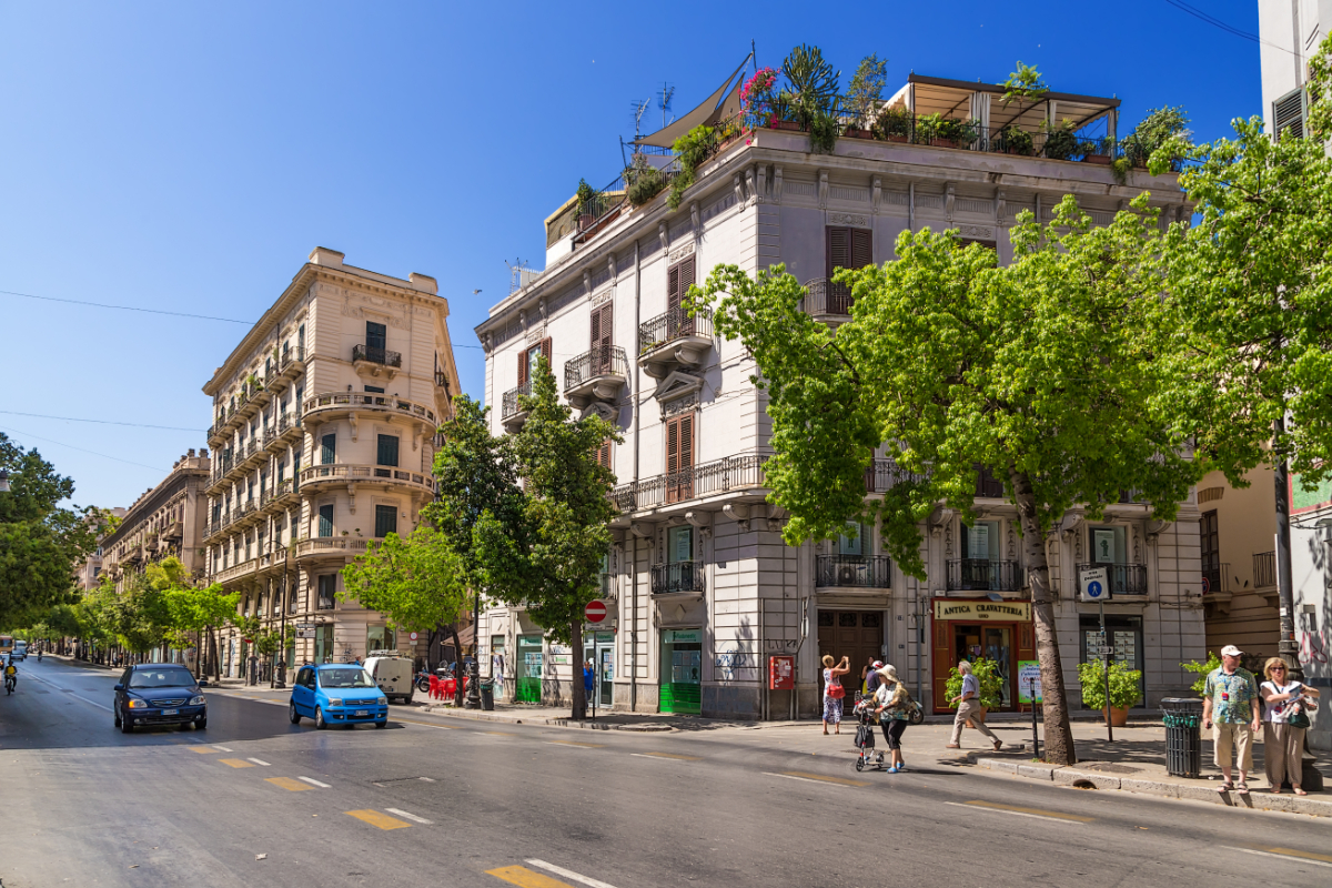 Panoramic view of a street and buildings on the side in Palermo, Italy