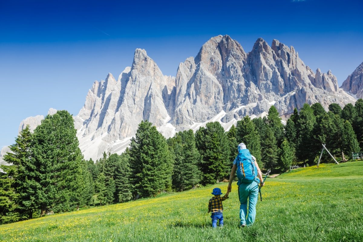 Mother and child hiking the Adolf Munkel trail in Dolomites, Italy