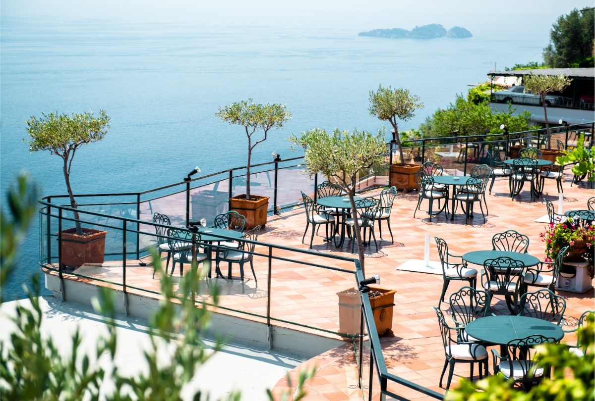 Al fresco restaurant tables and seats at Amalfi Coast, Italy