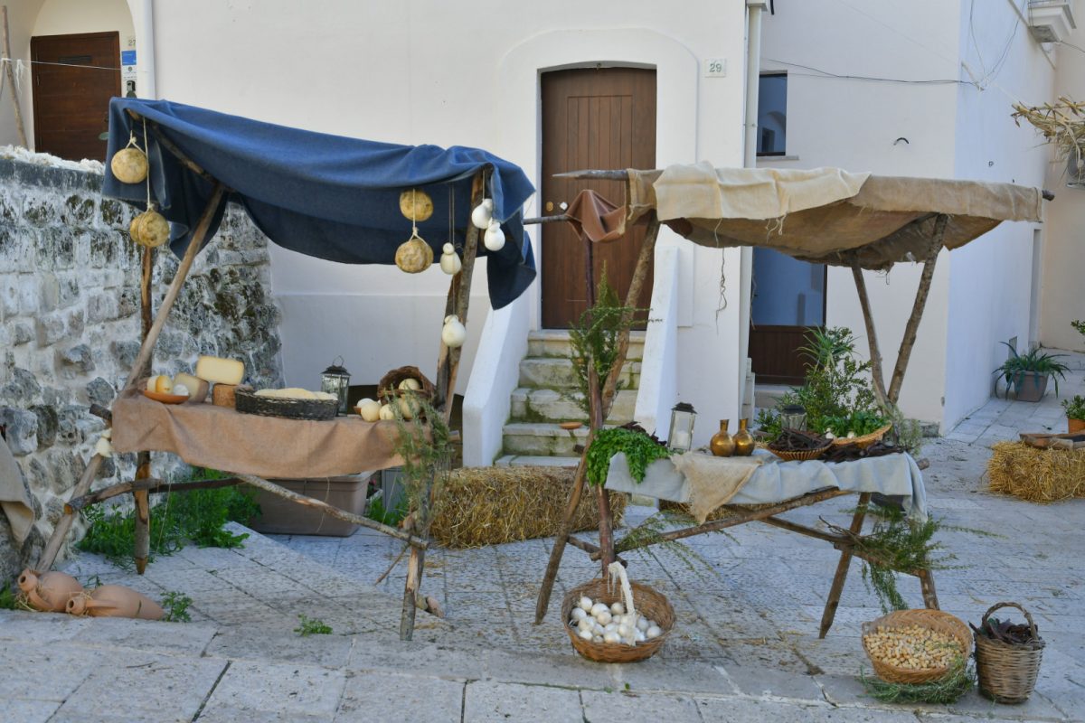 Cheese and herb market stall in Gravina in Puglia, province of Bari, Italy