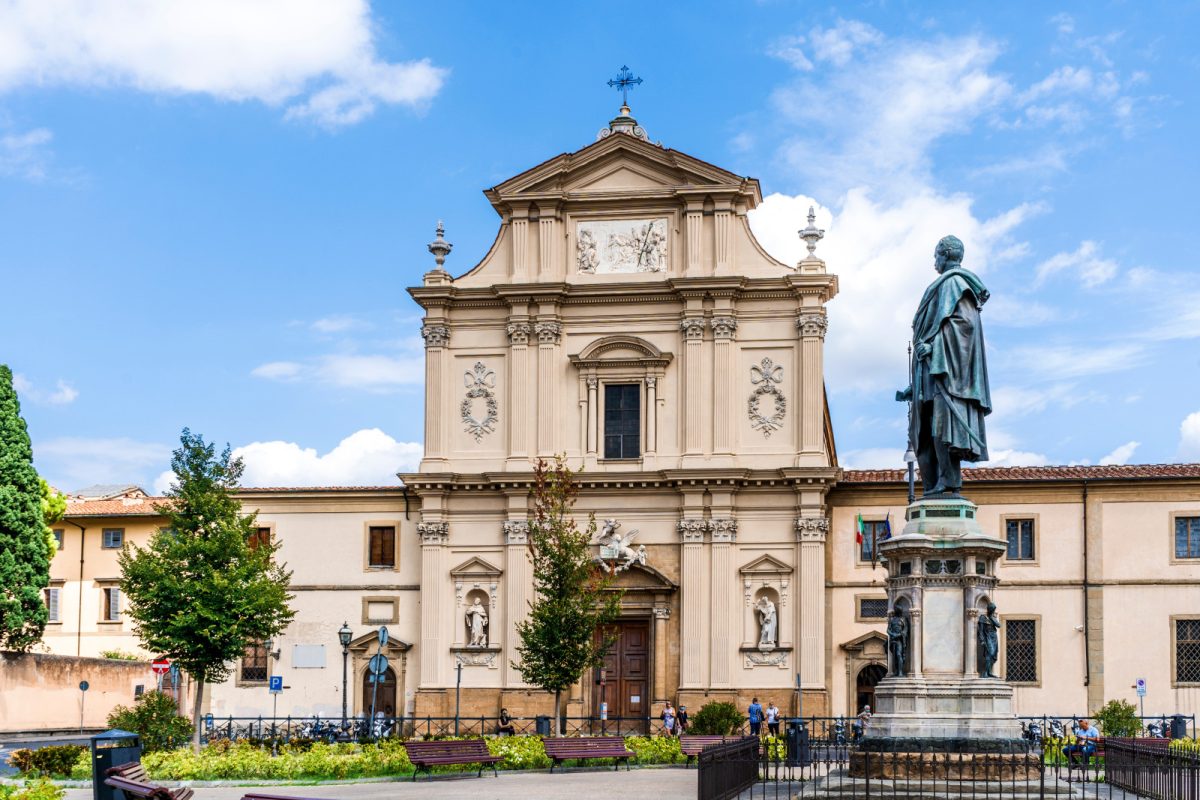 Exterior of the Basilica of San Marco  and Manfredo Fanti's statue in Florence, Italy