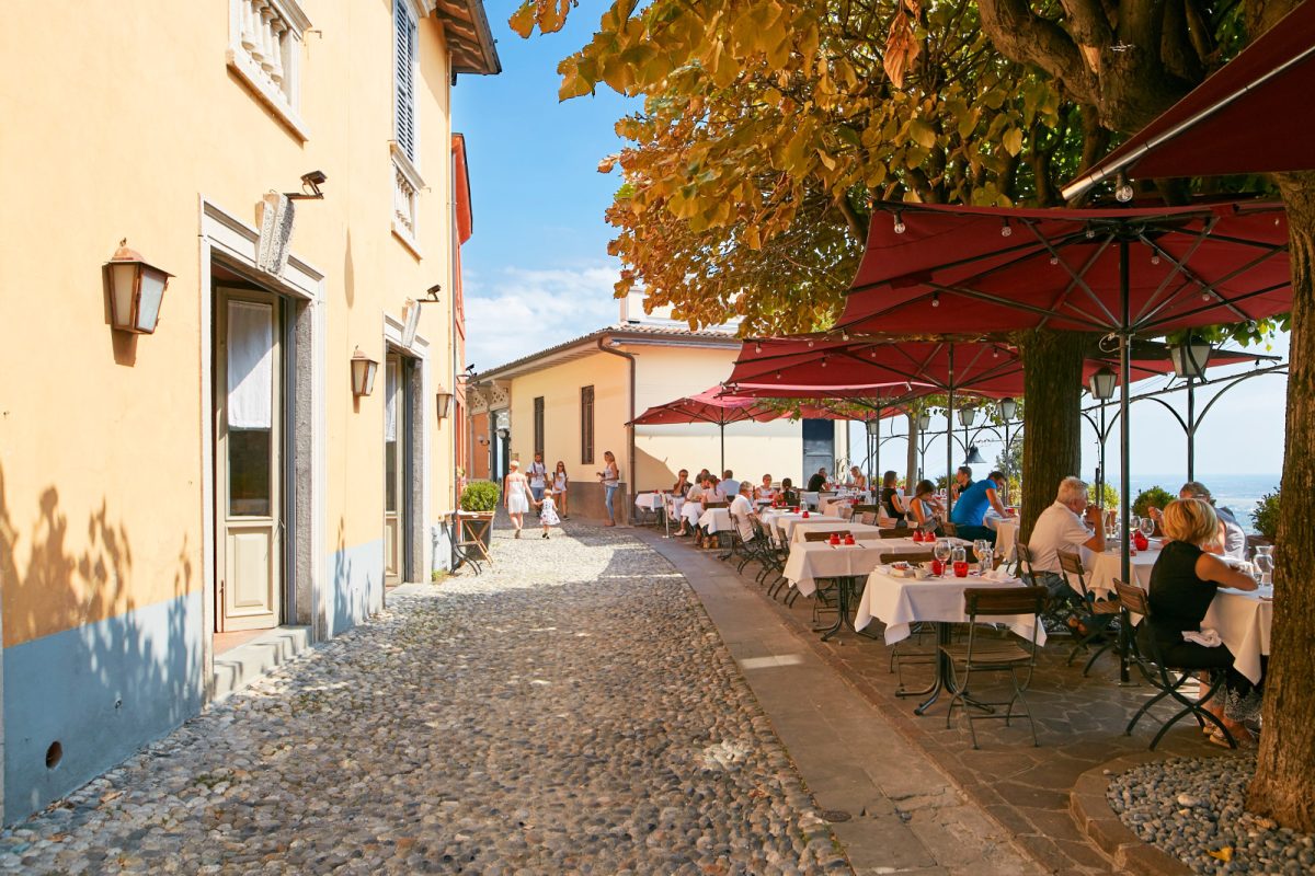 Cozy street cafe outdoor dining space in Bergamo, Italy