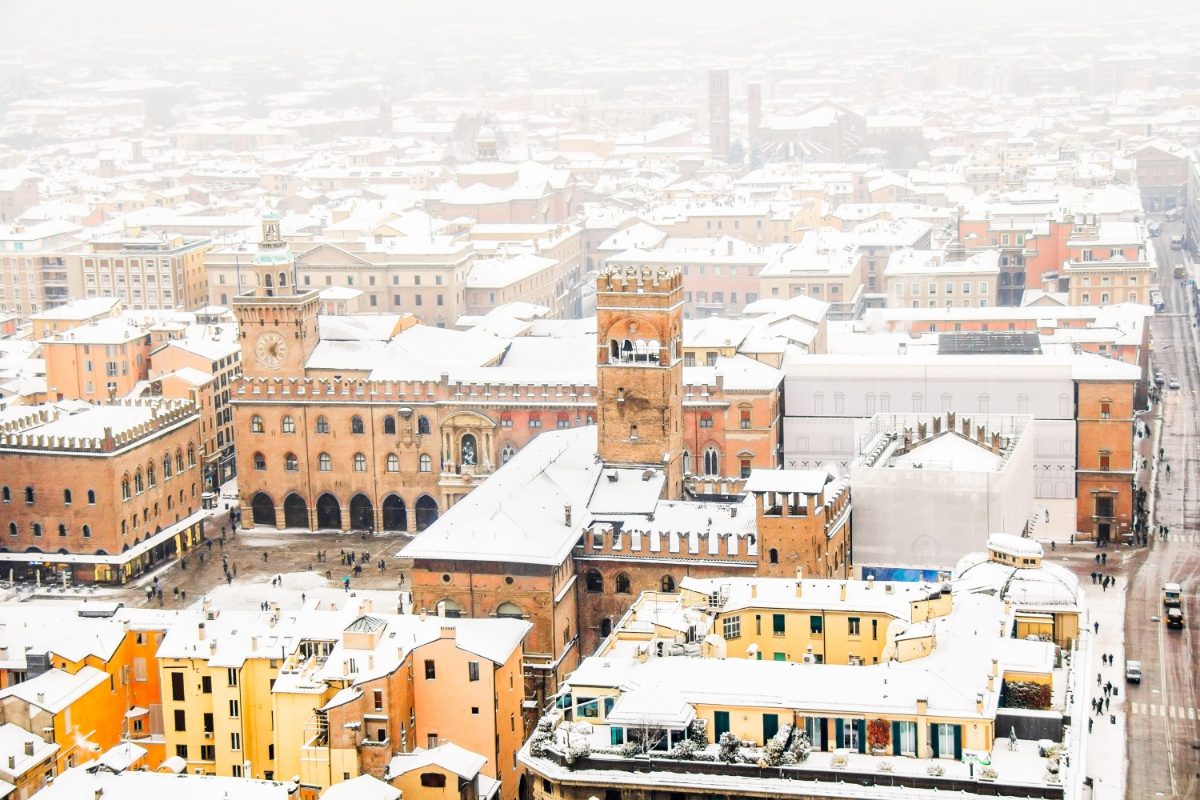 Aerial view of downtown Bologna, Italy covered win snow during winter