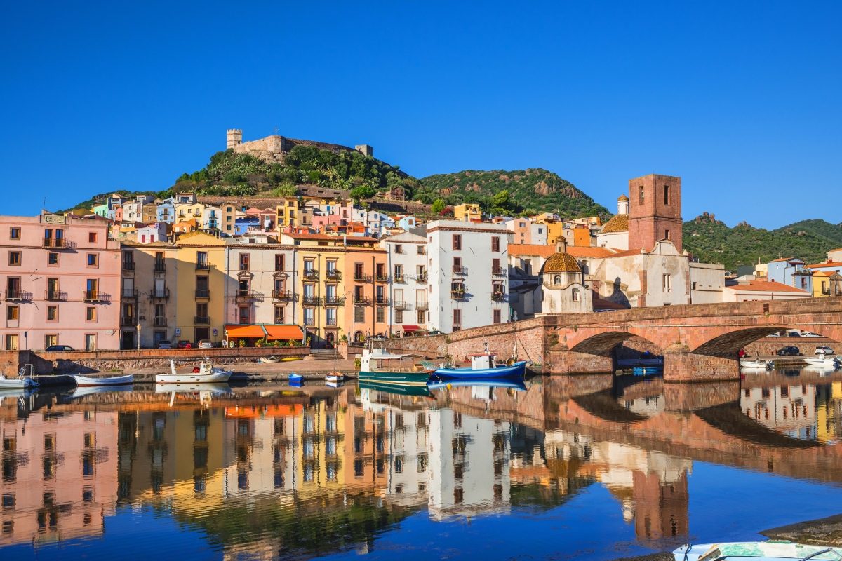 Beautiful buildings and boats of the Bosa town in Sardinia Island, Italy