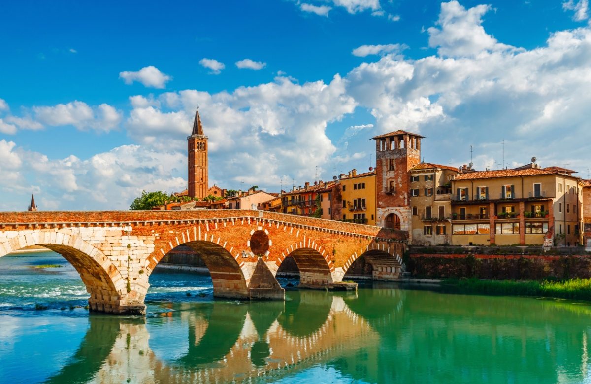 Panoramic view of the Bridge Ponte Pietra on Adige river and the skyline of Verona, Italy