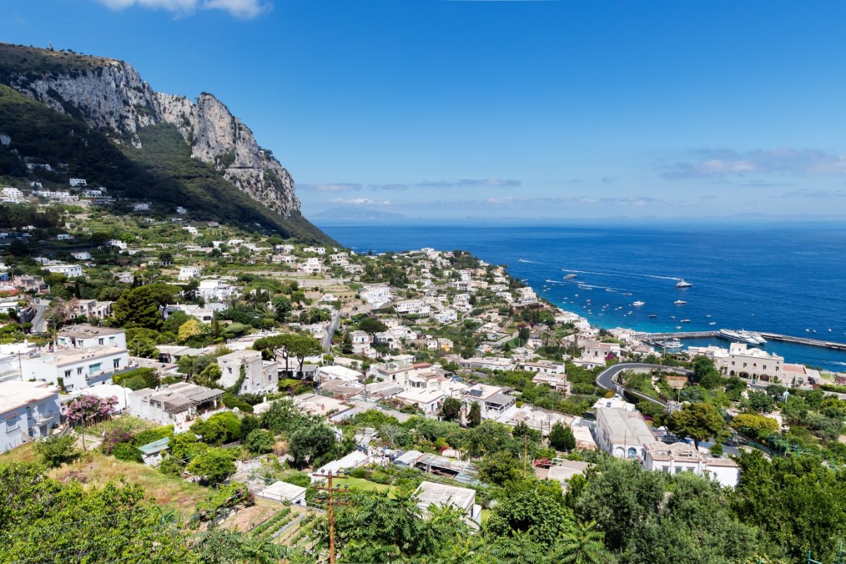 Aerial view of the houses, buildings, and a mountain peak on the Capri island, Campania region, Italy