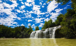 Panoramic view of the Cascata del Sasso waterfall and skyline in Marche region, Italy