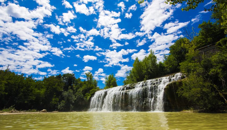 Panoramic view of the Cascata del Sasso waterfall and skyline in Marche region, Italy