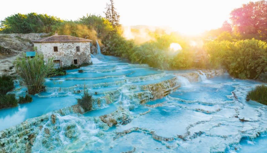 Panoramic sunrise view of the Cascate del Mulino at Manciano in Tuscany, Italy