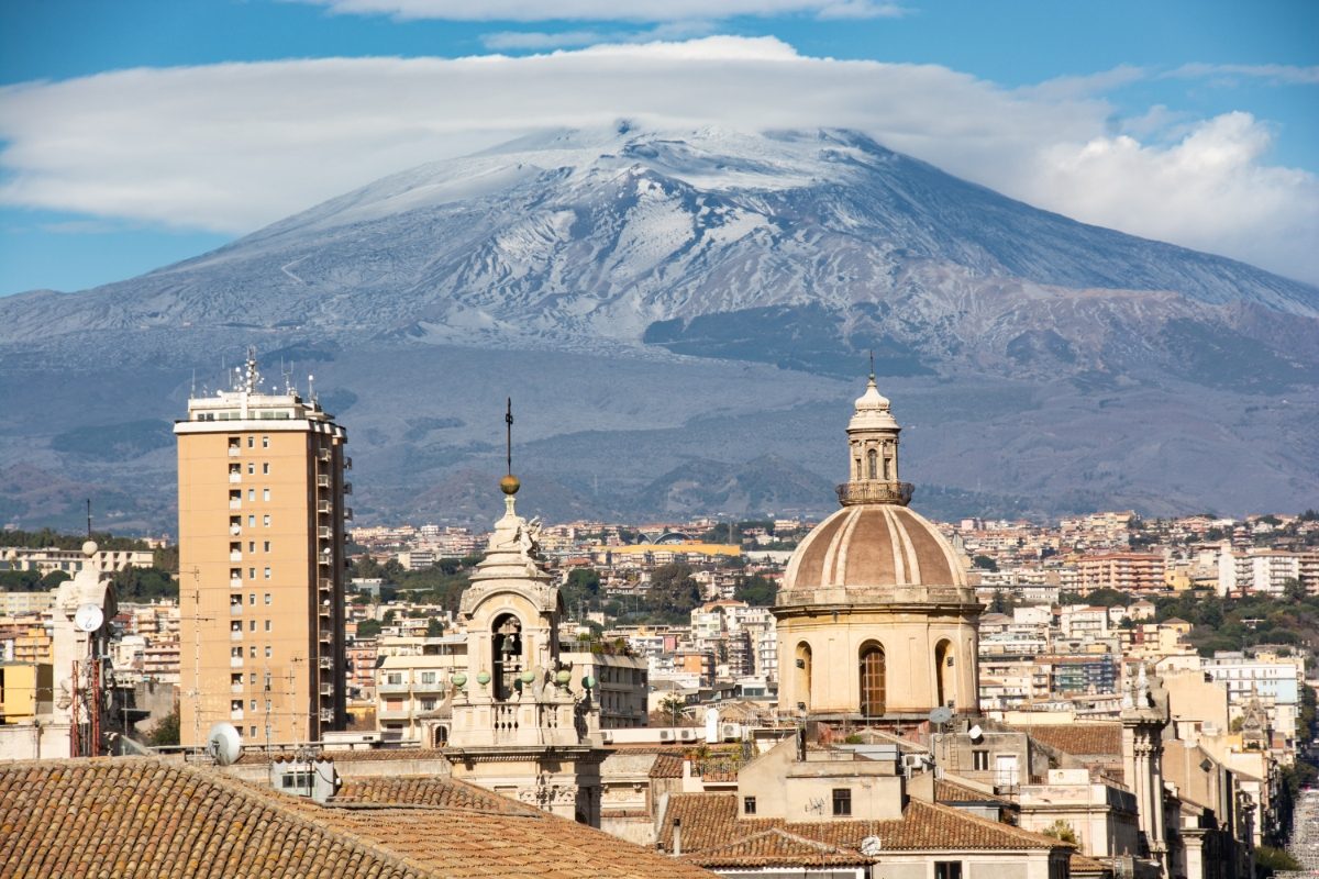 Aerial view of Catania, Italy cityscape with Mount Etna in the background