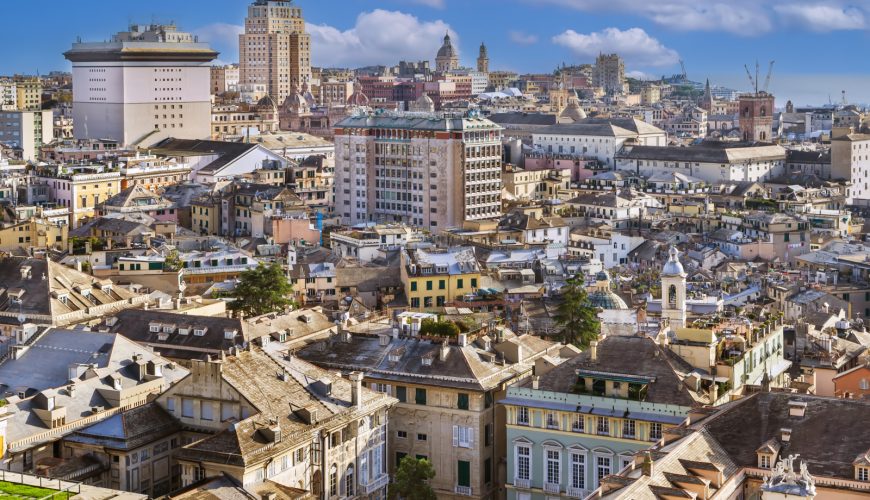 Scenic view of Genoa City, Italy, showcasing colorful buildings along the waterfront and the vibrant Mediterranean atmosphere