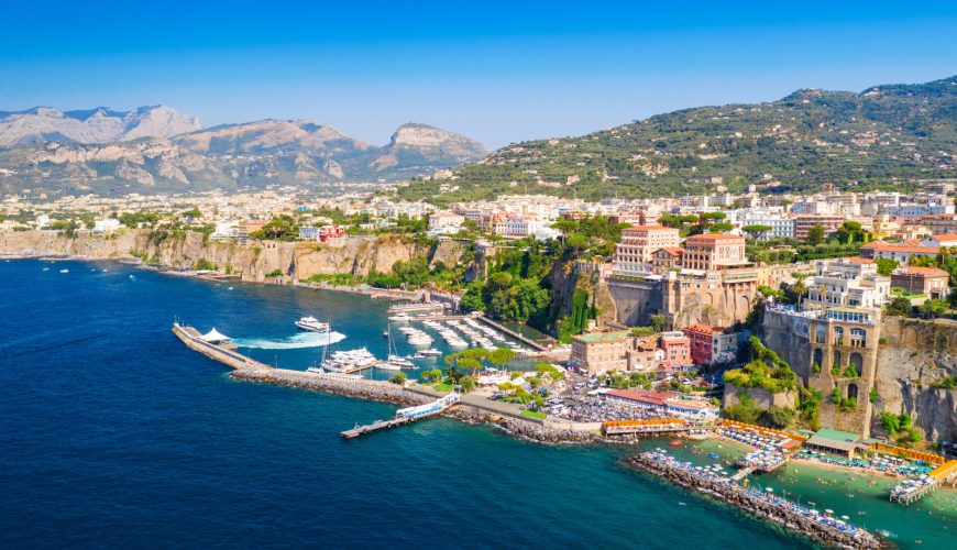 Aerial view of Sorrento's stunning coastline, showcasing cliffs, turquoise waters, and vibrant greenery