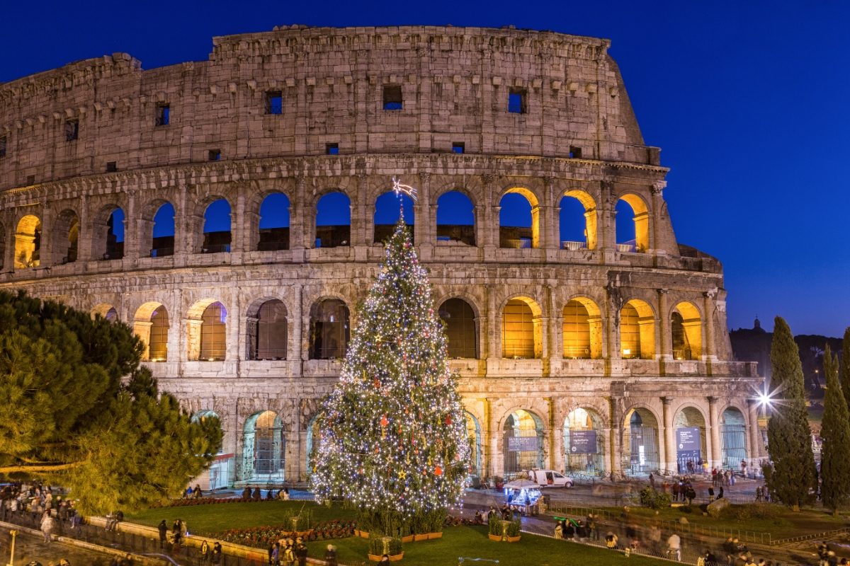 Christmas tree with lights in front of the Colosseum in Rome, Italy at Christmas