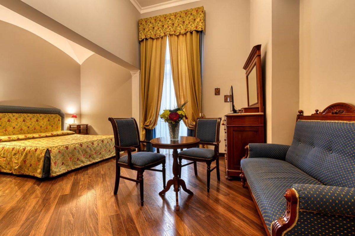 Room interior and accommodation at Decumani Hotel de Charme, Naples, Italy