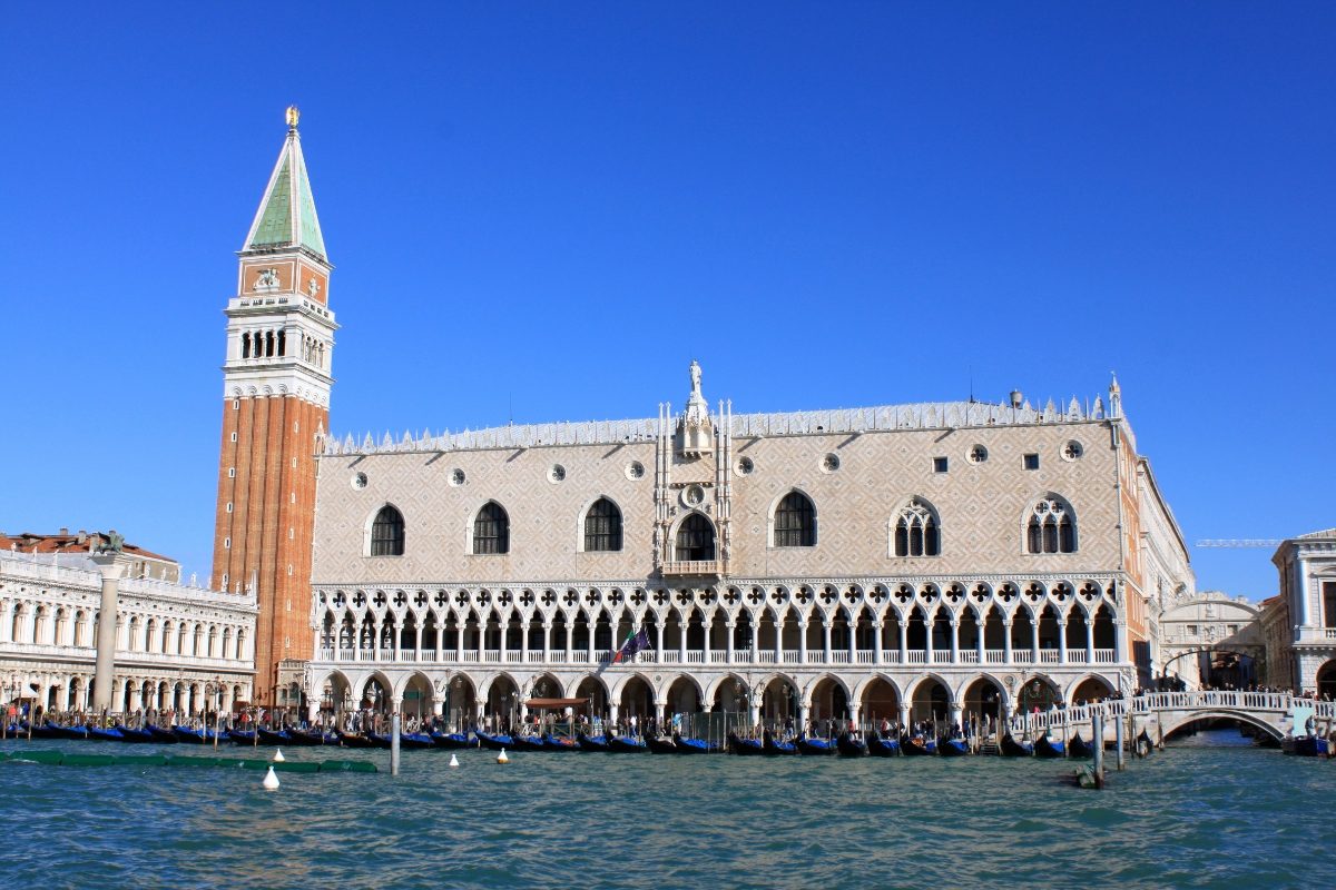 Panoramic viewof the Doge's Palace exterior and row of gondolas in Venice, Italy