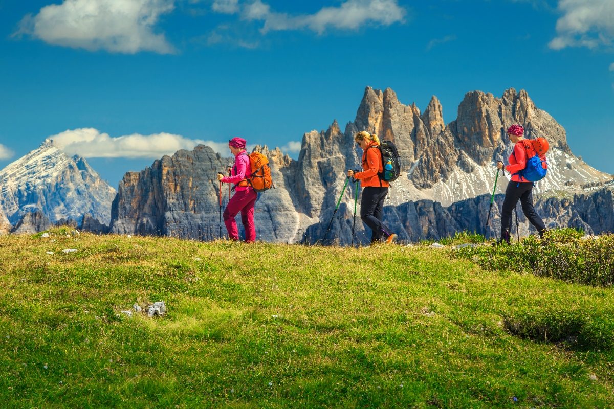 Group of women hiking the trails and mountains in Dolomites, Italy