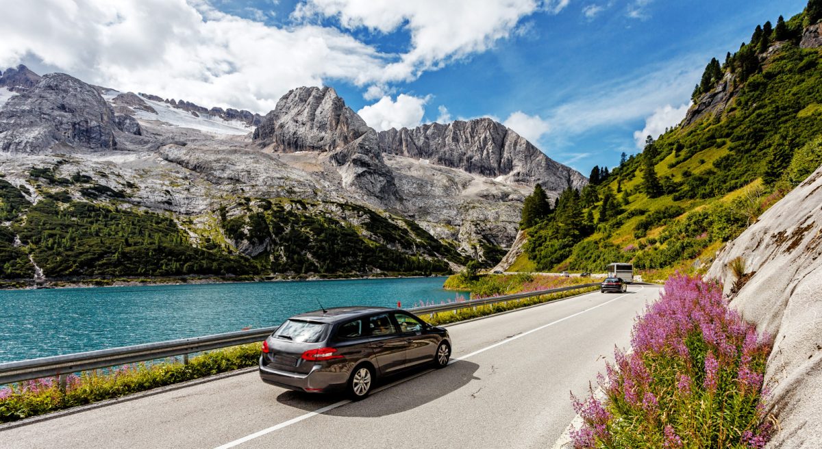 Scenic drive near Fedaia lake and Marmolada mountain located in the Dolomites, Italy