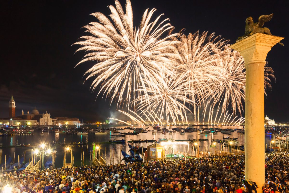 Crowd and the fireworks view at Festa del Redentore celebration in Venice, Italy