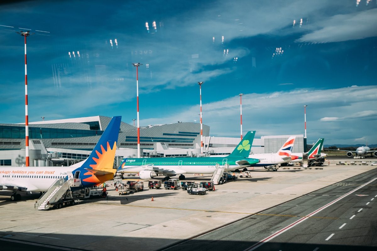 Row of different airline aircrafts at Fiumicino International Airport in Rome, Italy