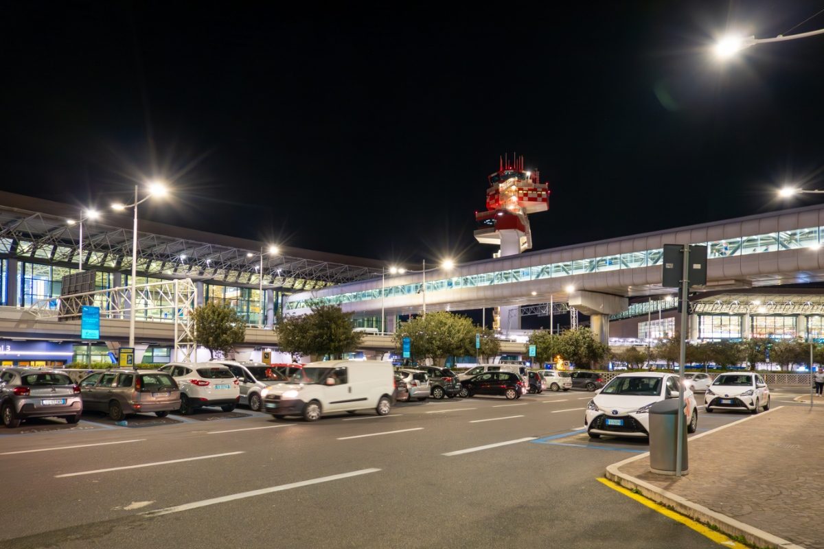 Cars and exterior of the Leonardo da Vinci International Airport or the Fiumicino International Airport in Rome, Italy