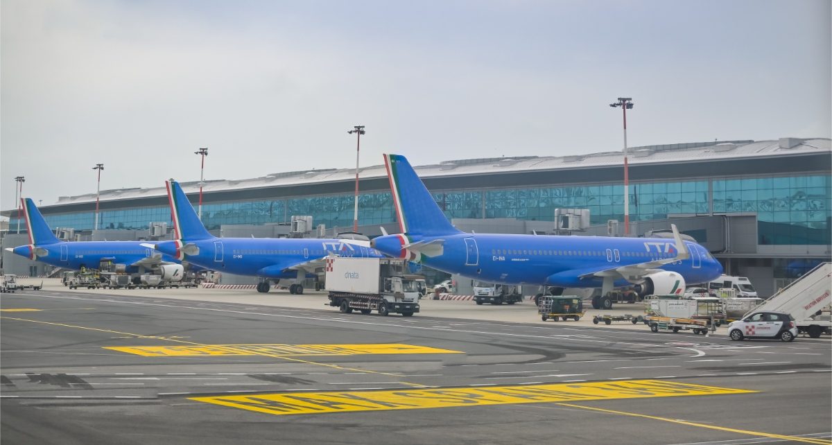 Row of parked Alitalia aircrafts at Fiumicino International Airport in Rome, Italy