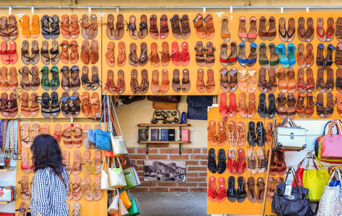 Wall of leather sandals for sale t the San Lorenzo market in Florence, Italy