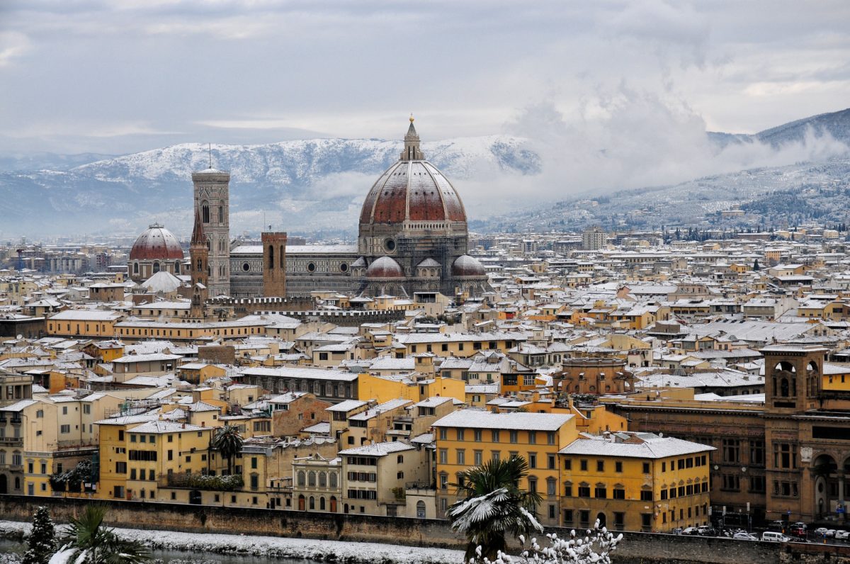 Cathedral Santa Maria del Fiore and Florence, Italy cityscape covered in snow during the winter