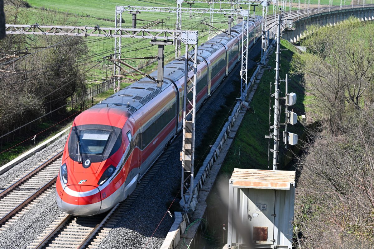 Frecciarossa high speed train running on the tracks in Italy