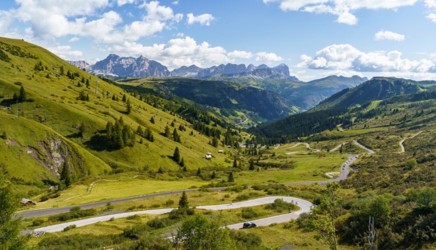 Scenic panorama of the Great Dolomites Road in Italy, featuring stunning mountain landscapes and vibrant natural surroundings