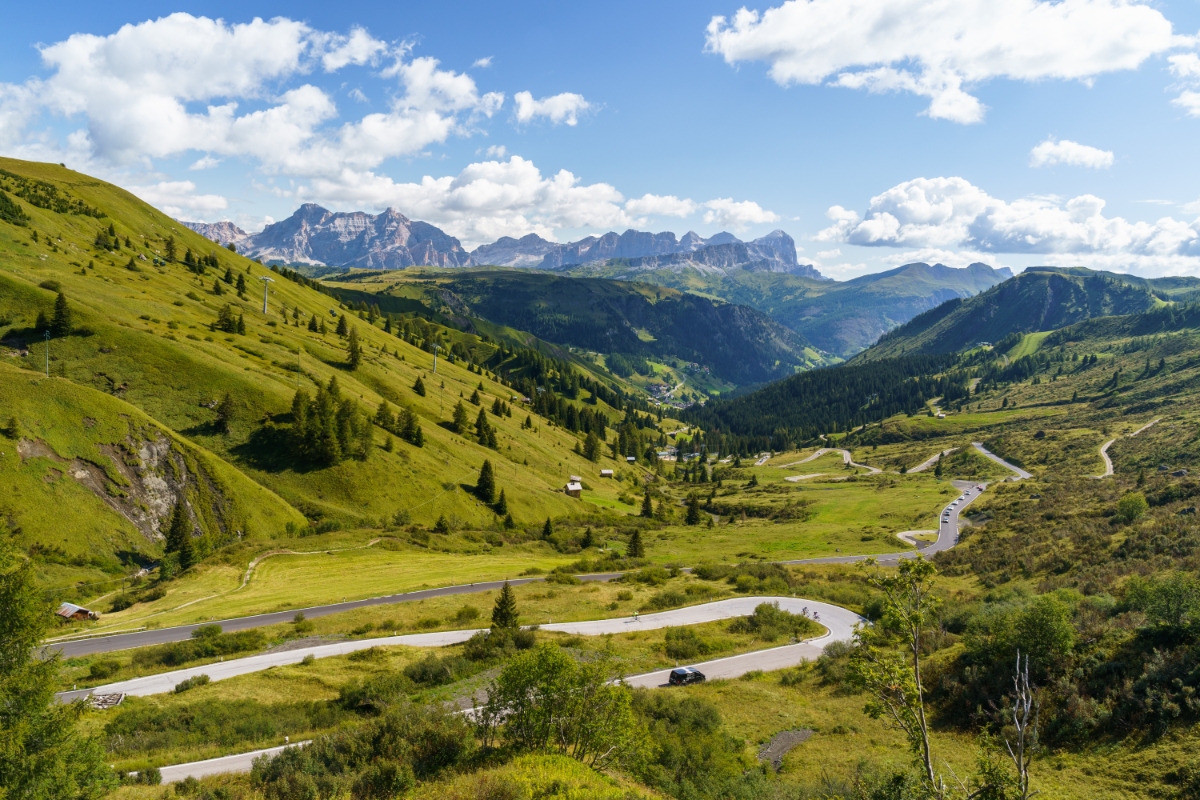 Scenic panorama of the Great Dolomites Road in Italy, featuring stunning mountain landscapes and vibrant natural surroundings