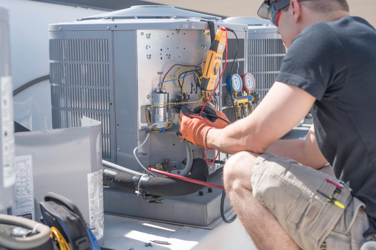 Male HVAC technician checking the HVAC system