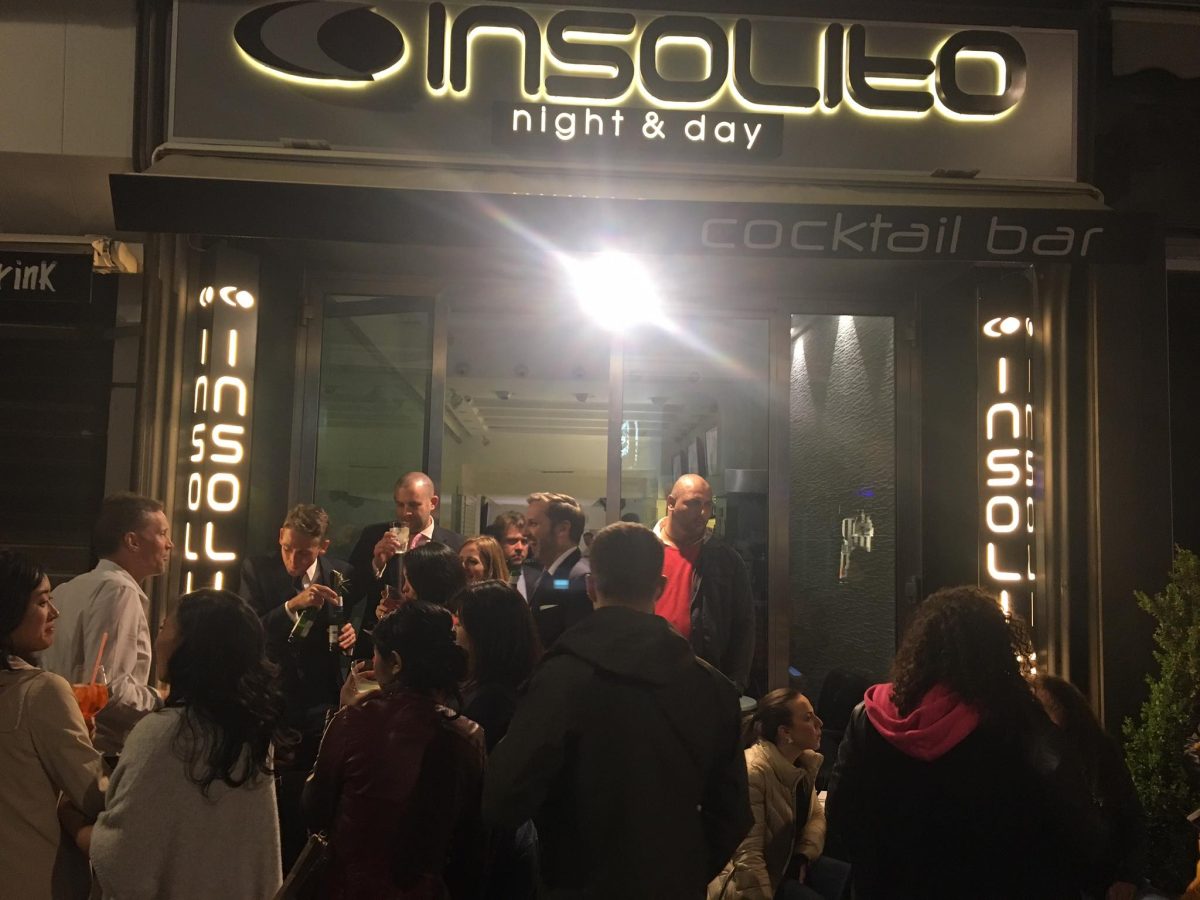 Crowd and entrance of the Insolito Bar in Sorrento, Italy