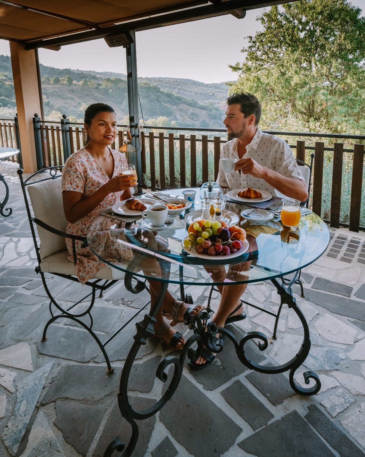 Couple enjoying outdoor dining at the Italian country side in Italy