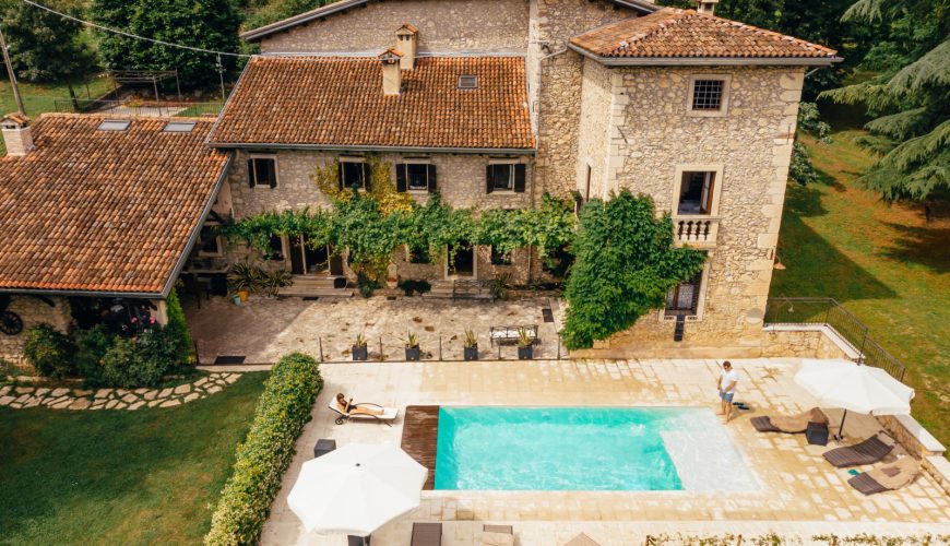 Aerial view of a villa in Italy with a swimming pool