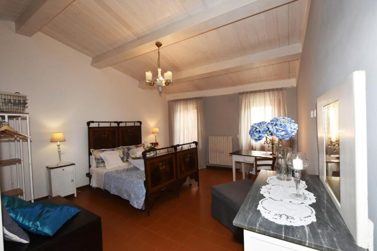 Bedroom interior in La Casa del Borgo Antico in Spoleto, Umbria, Italy