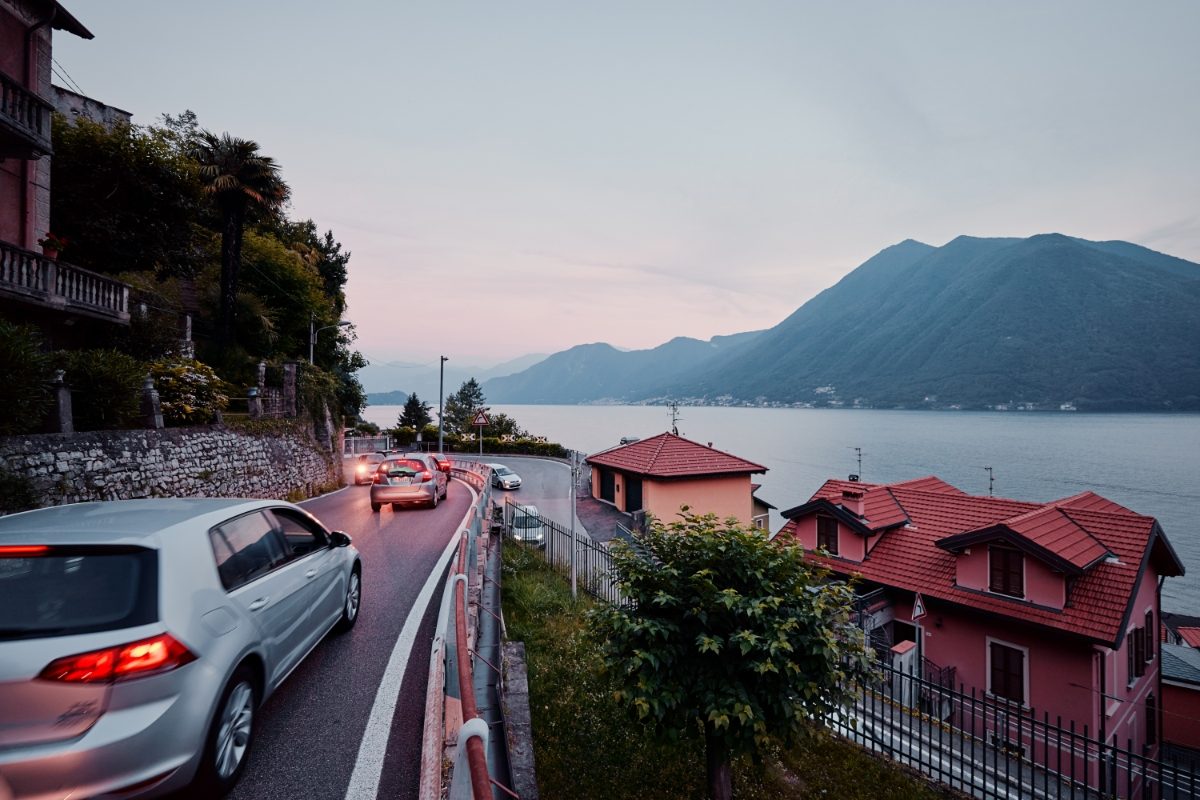 Road with cars on the coast of Lake Como, Italy