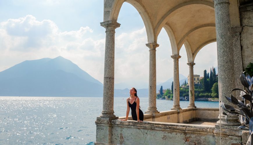 Young woman Lake Como tourist wearing a fancy black dress