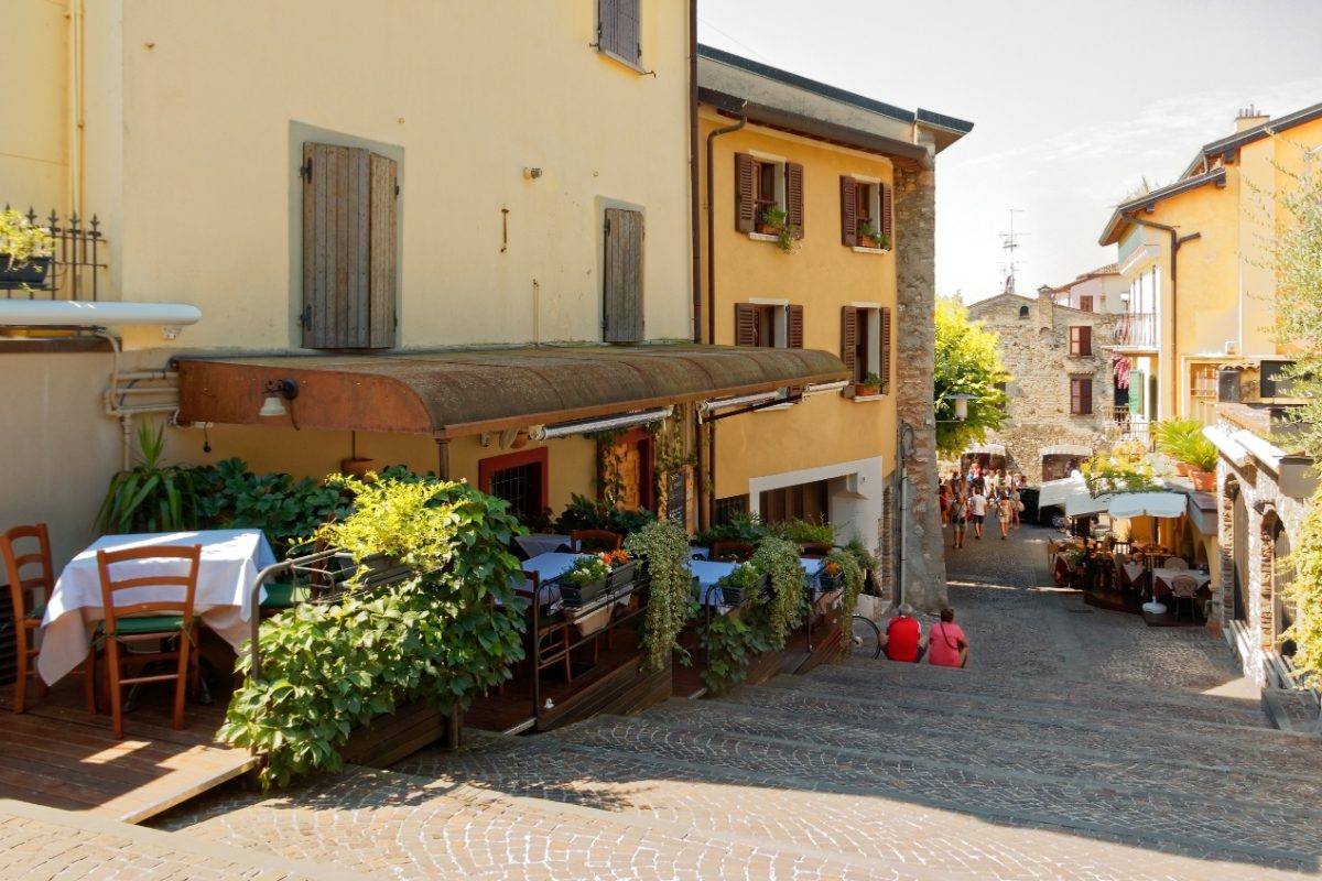 Cozy cafe on the city street in Sirmione, Lake Garda, Italy