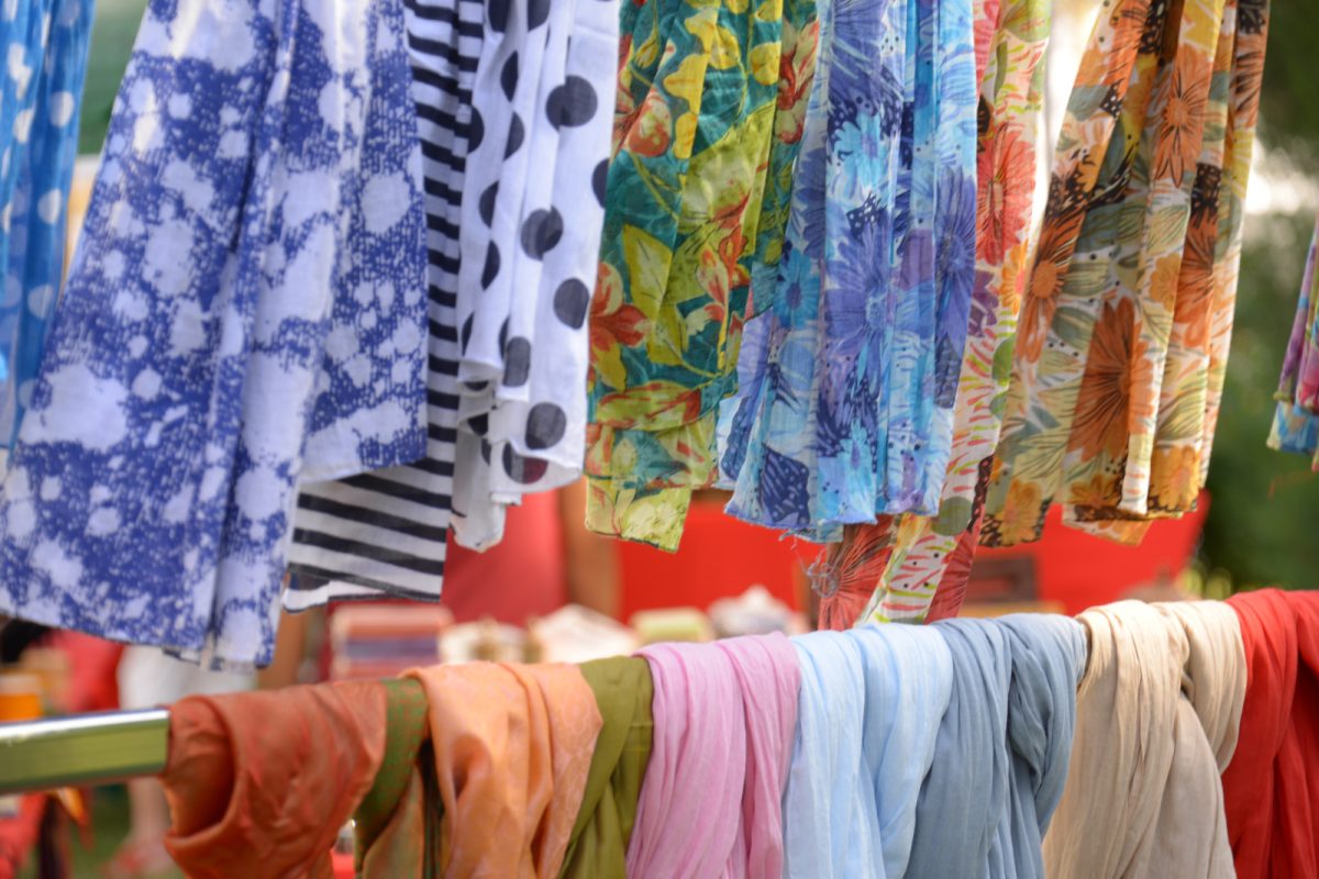 Colorful fabrics display at the craft market in Lucca, Tuscany, Italy