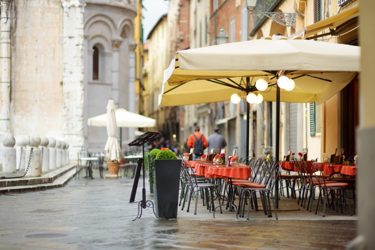 Outdoor seats of a restaurant in Lucca, Italy