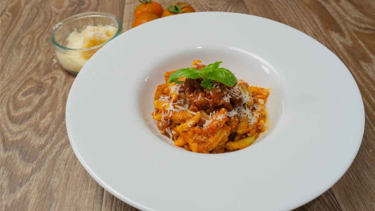 Close-up of the malloreddus  Sardinian pasta or the Sardinian gnocchetti served on a white plate