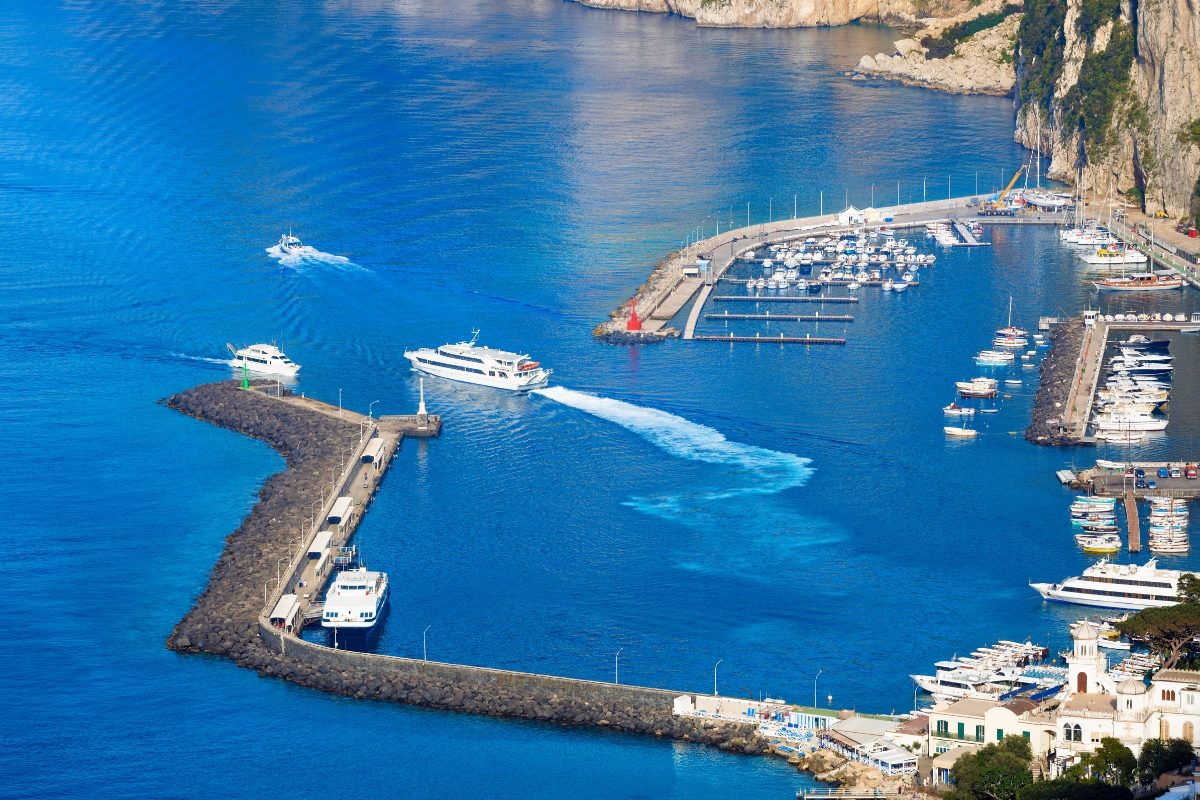 Aerial view of the yachts and a ferry boat at the Marina Grande in in Capri, Italy