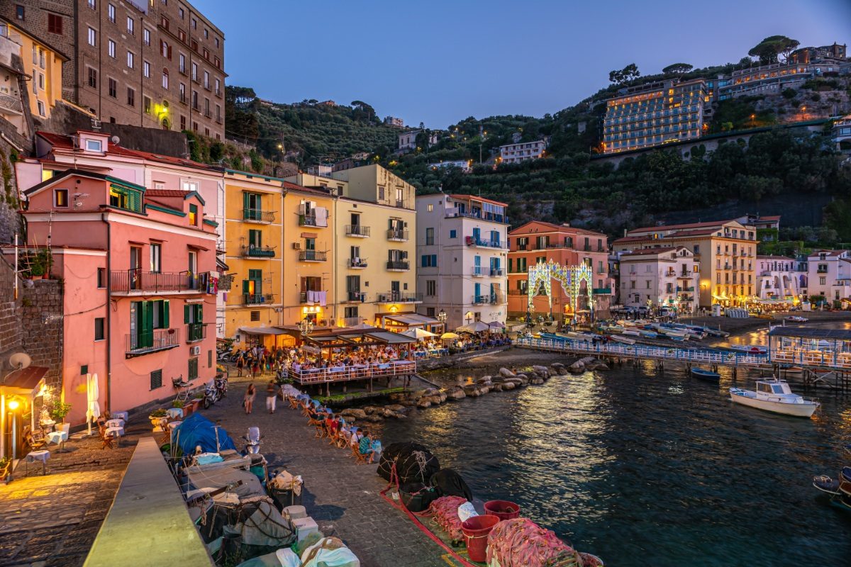 Panoramic view of the Marina Grande at night in Sorrento, Italy