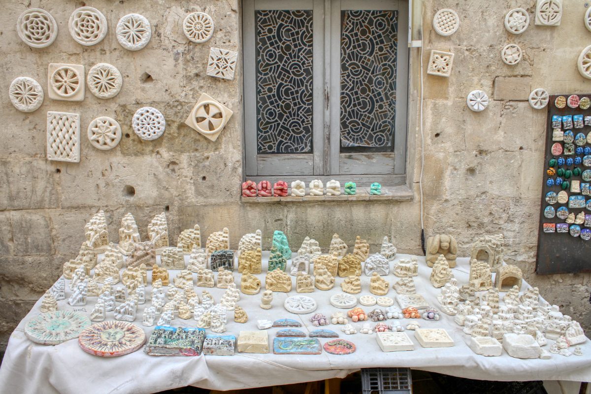 Souvenirs sold at a stall on the streets of Matera, Basilicata, Italy