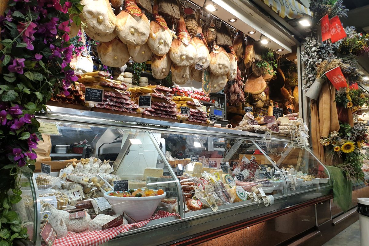 Italian market ham and cheese stall at Mercato Centrale in Florence, Italy